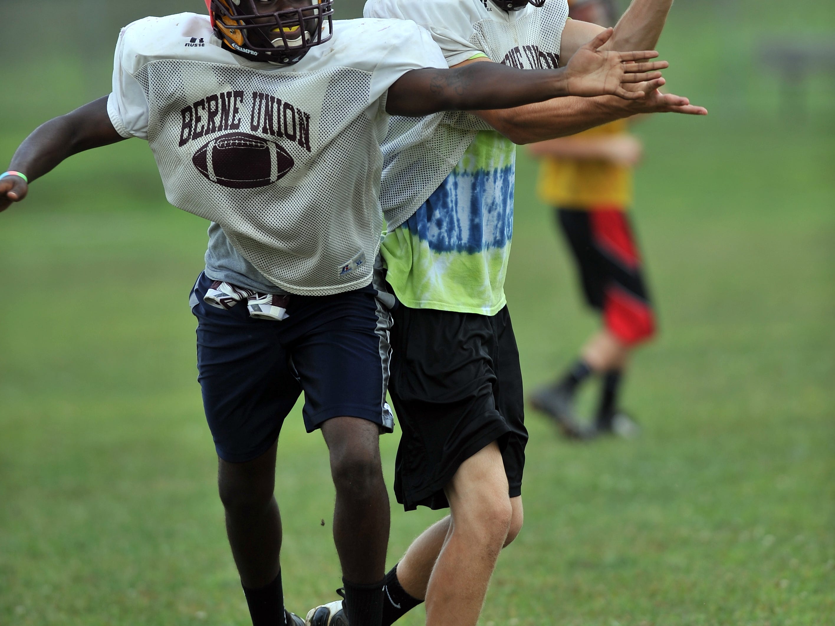  Zackh Maust picks off a pass during a Berne Union High School football practice Aug. 12 in Sugar Grove. 