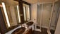 Haven Penthouse bathrooms have two bowl sinks, a curved oval bathtub and separate shower.