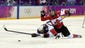 USA forward Hilary Knight (21) is called for a cross-checking penalty against Canada forward Hayley Wickenheiser (22) in overtime.