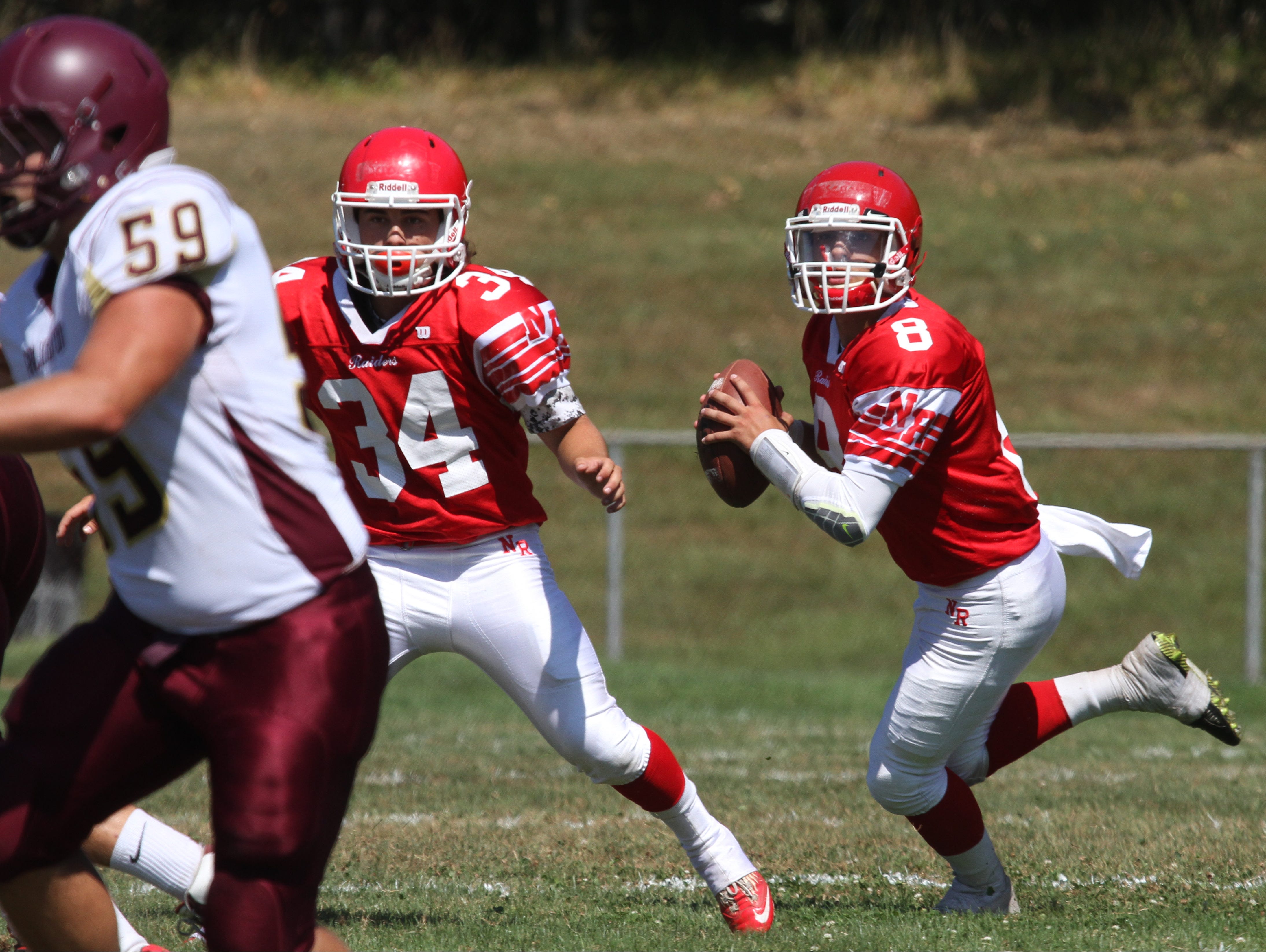 North Rockland quarterback Dylan Senatore looks for an opening during action in the home opener between North Rockland and Arlington at North Rockland High School, Sept. 5, 2015.