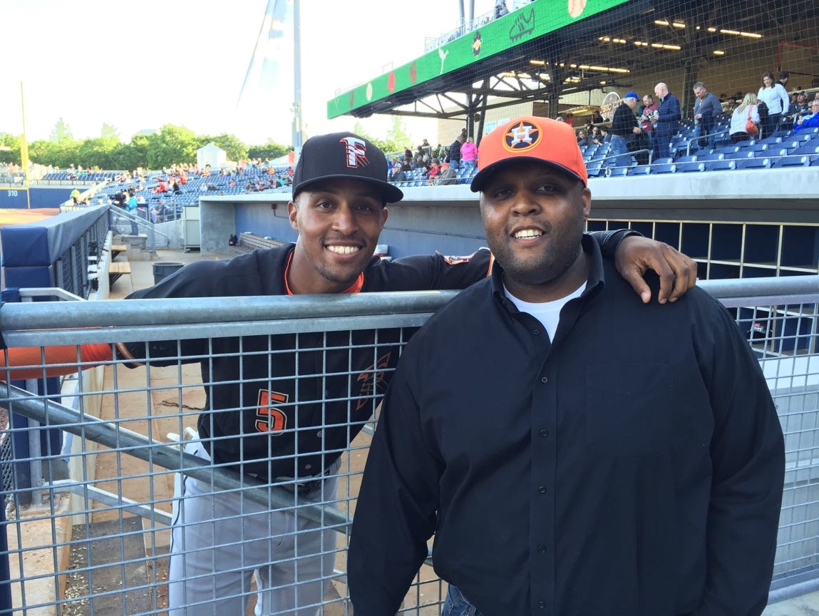 Former Centennial High and Vanderbilt standout Tony Kemp, left, poses with his older brother, Corey, prior to Saturday's battle between Kemp's Fresno Grizzlies and the Nashville Sounds.