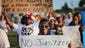 Demonstrators protest the shooting death of unarmed teenager Michael Brown  in Ferguson, Mo.