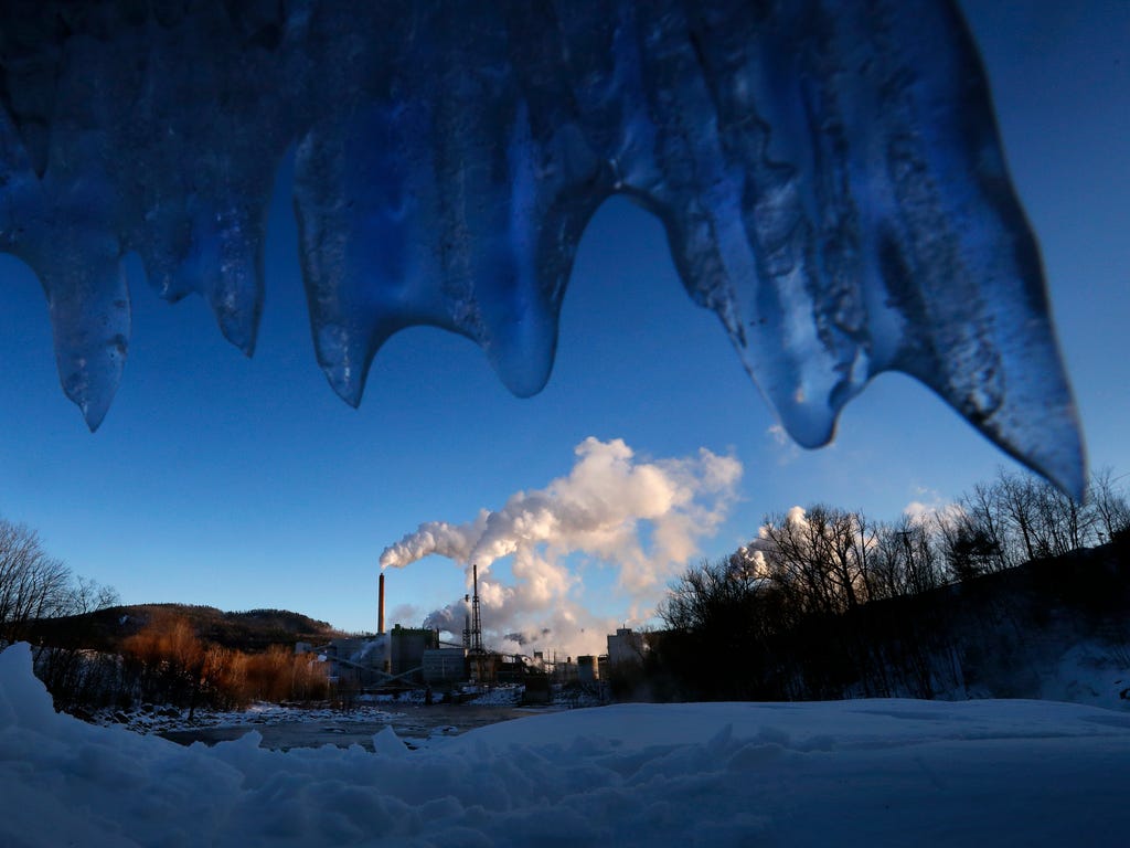 Icicles hang near the Androscoggin River, upstream from the Catalyst Paper Mill in Rumford, Maine, where the temperature at sunrise was -2 degrees Fahrenheit, Feb. 3, 2018.