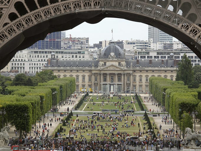 Paris' Parc du Champ-de-Mars is the quintessential place to picnic with views of the Eiffel Tower. Find local breads, cheeses, wine and desserts nearby, and vendors beneath the tower.