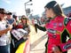 Danica Patrick greets fans on the grid during qualifying for the NASCAR Nationwide Series Dollar General 300 at Charlotte Motor Speedway on Oct 12, 2012 in Charlotte, N.C.