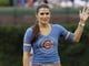 Danica Patrick waves before throwing out a ceremonial first pitch before a baseball game between the Houston Astros and the Chicago Cubs in Chicago, Sunday, July 1, 2012. 