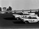 Lee Petty (42), driving an Oldsmobile, and Johnny Beauchamp (73), driving a Thunderbird, were neck and neck on the last lap of the inaugural Daytona 500 in 1959, but Petty nosed out Beauchamp at the finish line.