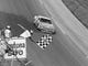 Cale Yarborough takes the checkered flag at the Daytona 500 for the final time in 1984. Yarborough also won in 1983, '77, and '68.