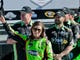 Danica Patrick waves to her fans after making NASCAR history by becoming the first woman to win a Sprint Cup pole. Patrick qualified first for the 2013 Daytona 500 on Feb. 17.
