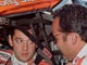 Stewart sits in his car in the garage area at Pocono International Raceway while talking with crew chief, Greg Zipadelli.   The photo, taken in 1999, is from Stewart's rookie season in the Cup series.