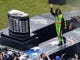 Danica Patrick waves to the crowd as she is introduced before the 2013 Daytona 500.
