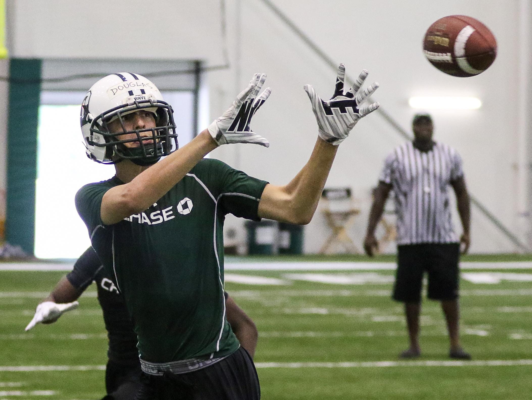 Delbarton's Matt Douglas catches a pass in the New York Jets 7-On-7 Tournament at the Atlantic Health Jets Training Center in Florham Park on June 12, 2015.