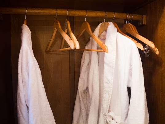 White Hotel gown on a hanger in the wardrobe