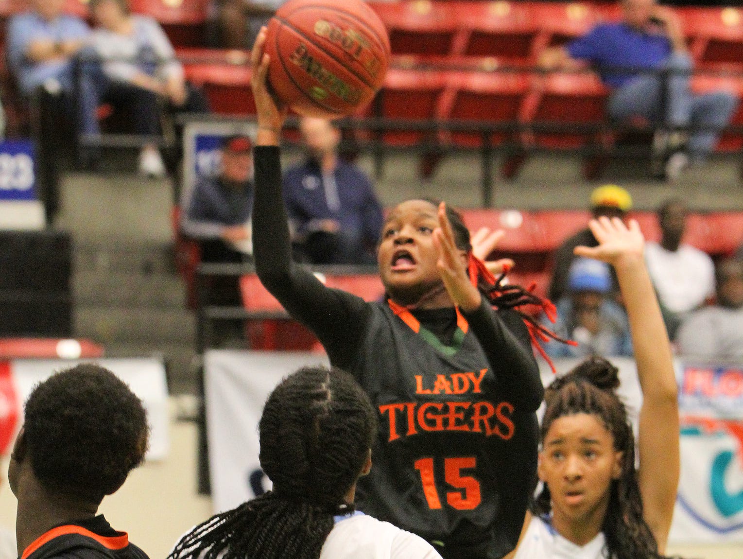 Dunbar's Dekeriva Patterson goes up for a basket as the Ribault defense closes in during the FHSAA Girls 5A Basketball semi finals Thursday February 18, 2016 in Lakeland, Florida. Dunbar lost the match 51-44.