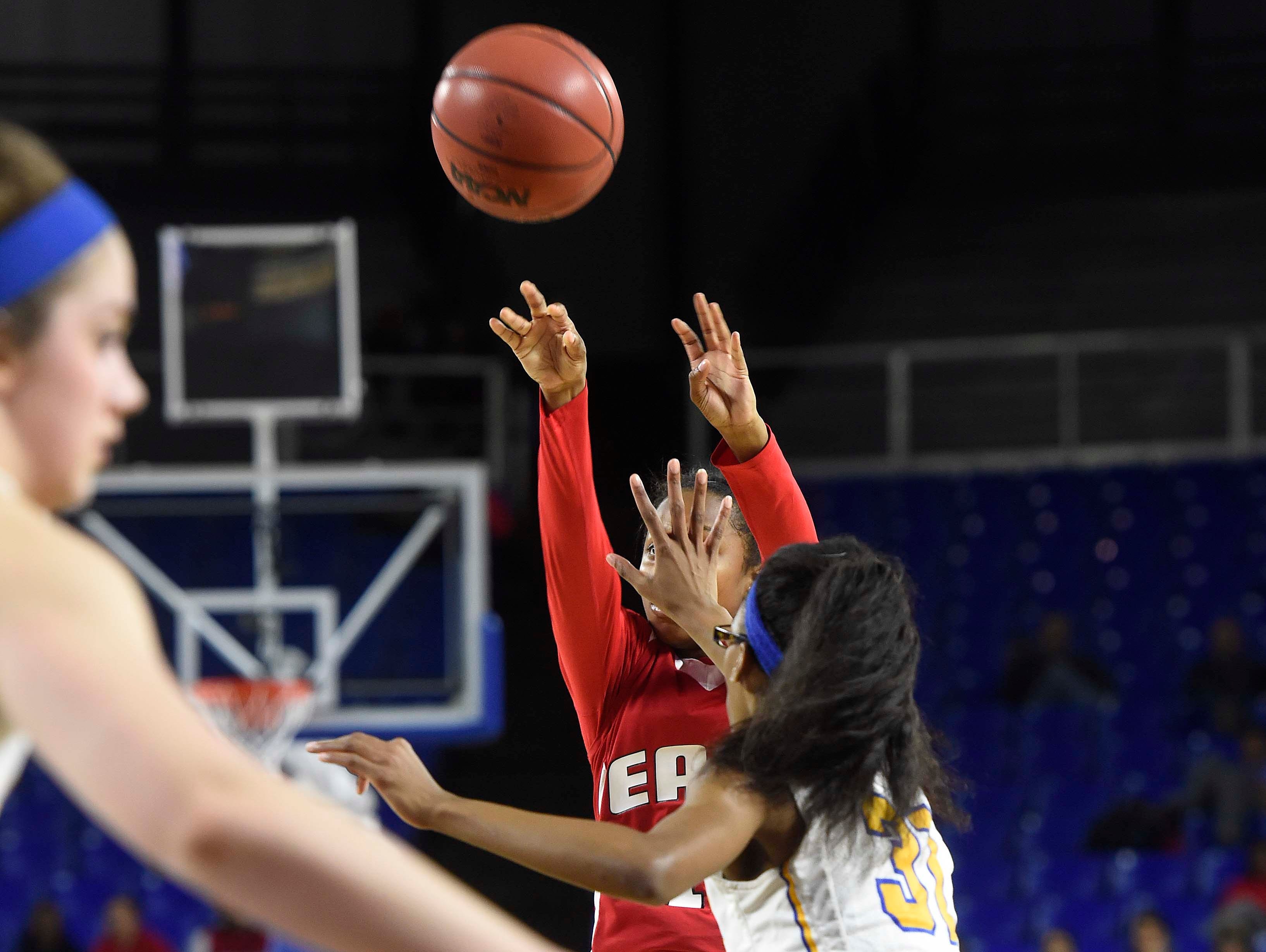 East's Le'Jzae Davidson (10) shoots for two with a hand in her face from Westview's Alexis Beam (32) as Westview High School leads 17-13 East Nashville at the half in the Division I Class AA Girl's basketball semi-finals at the Murphy Center on MTSU's campus March 11, 2016 in Murfreesboro, Tenn.