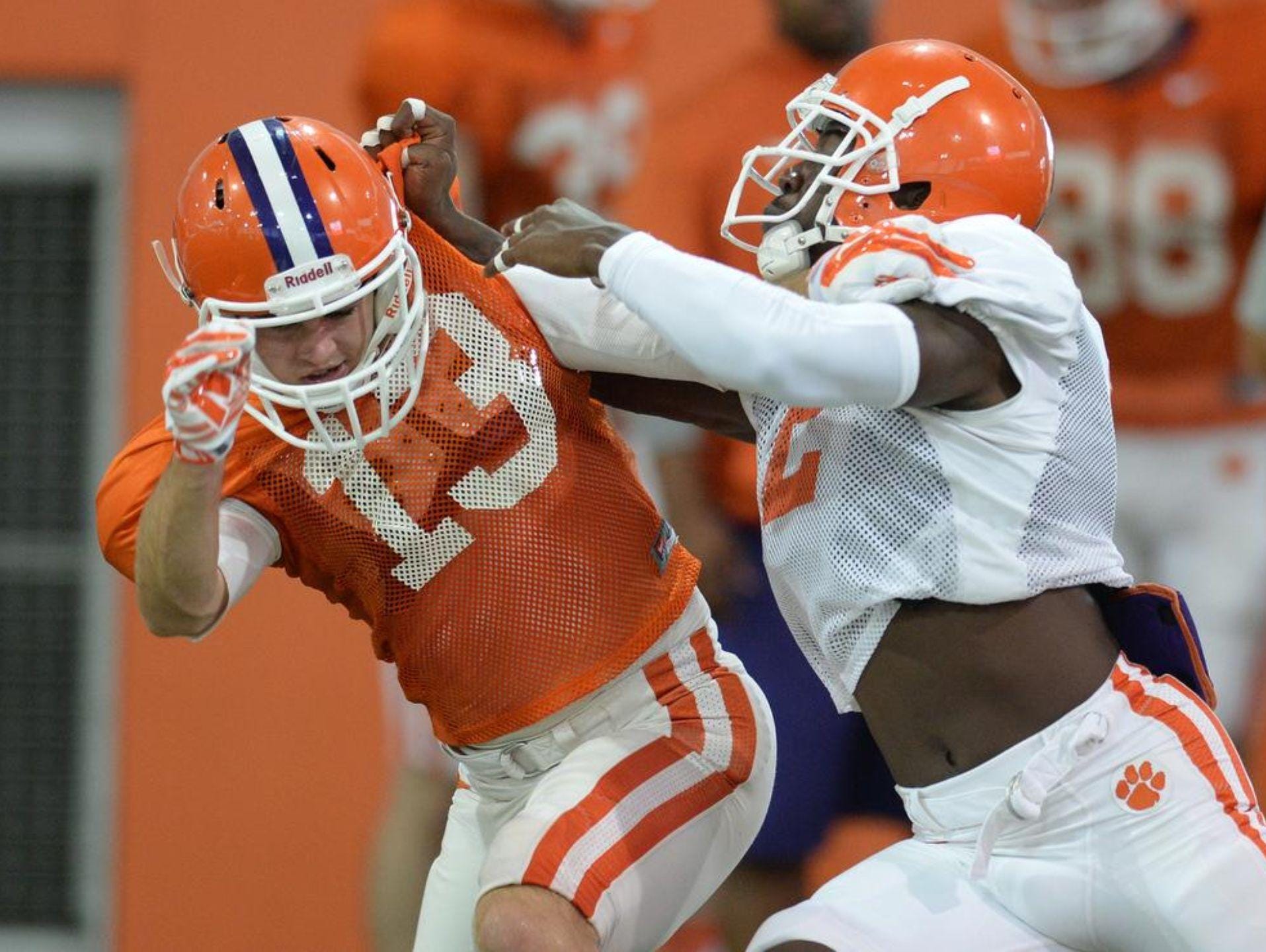Cornerback Mackensie Alexander, right, challenges receiver Hunter Renfroe during practice.