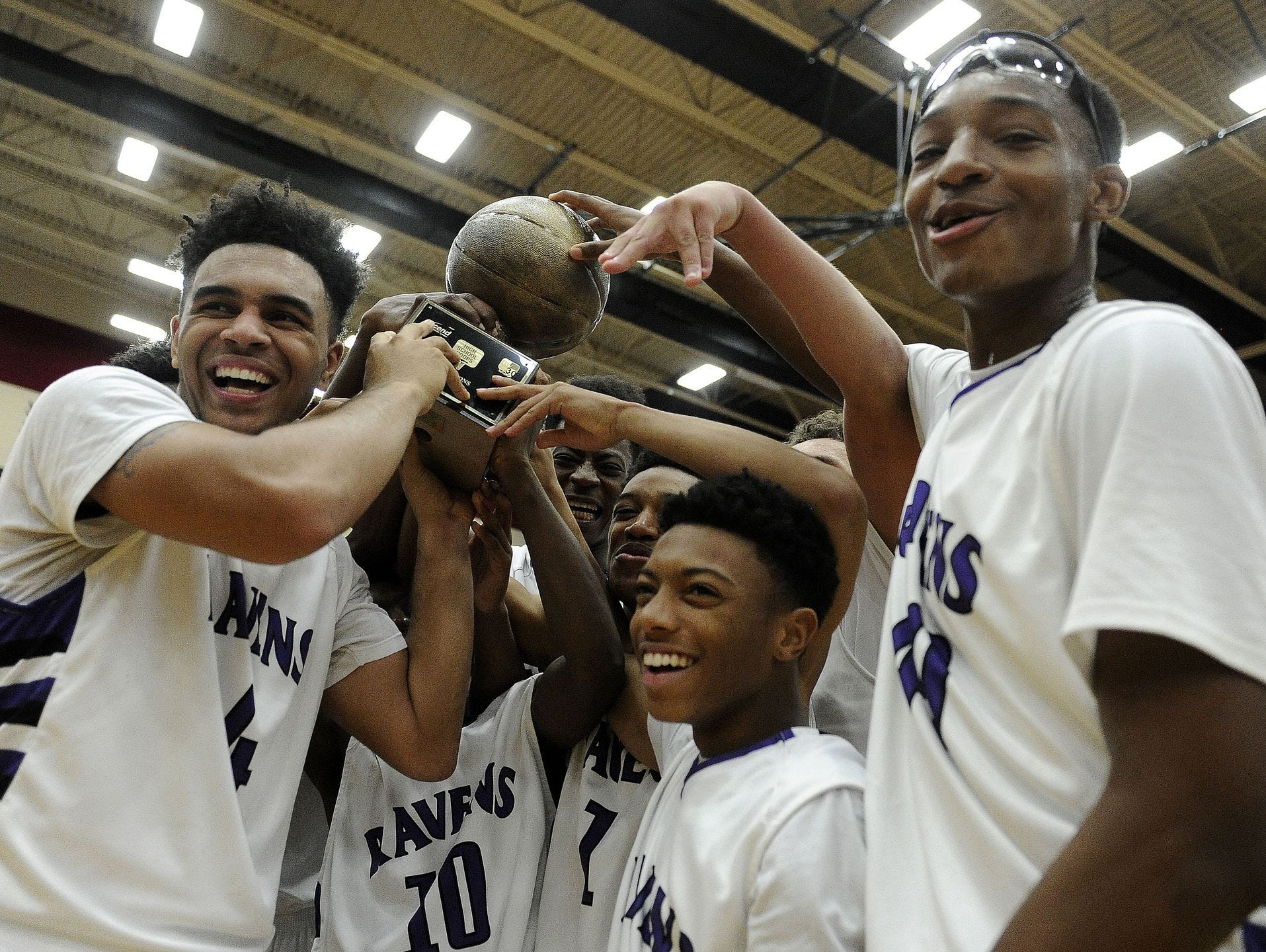 Cane Ridge players celebrate after the team's doubble-overtime win over Hillsboro on Friday.