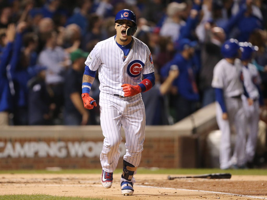 Chicago Cubs second baseman Javier Baez celebrates after hitting a solo home run against the Los Angeles Dodgers in the second inning in game four of the 2017 NLCS playoff baseball series at Wrigley Field in Chicago.
