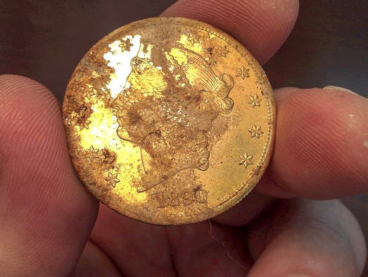 First of 1,400 discovered coins auctioned for $15K
