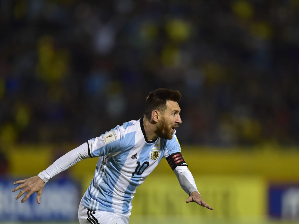 Argentina's Lionel Messi celebrates after scoring his third goal against Ecuador during their 2018 World Cup qualifier football match in Quito.