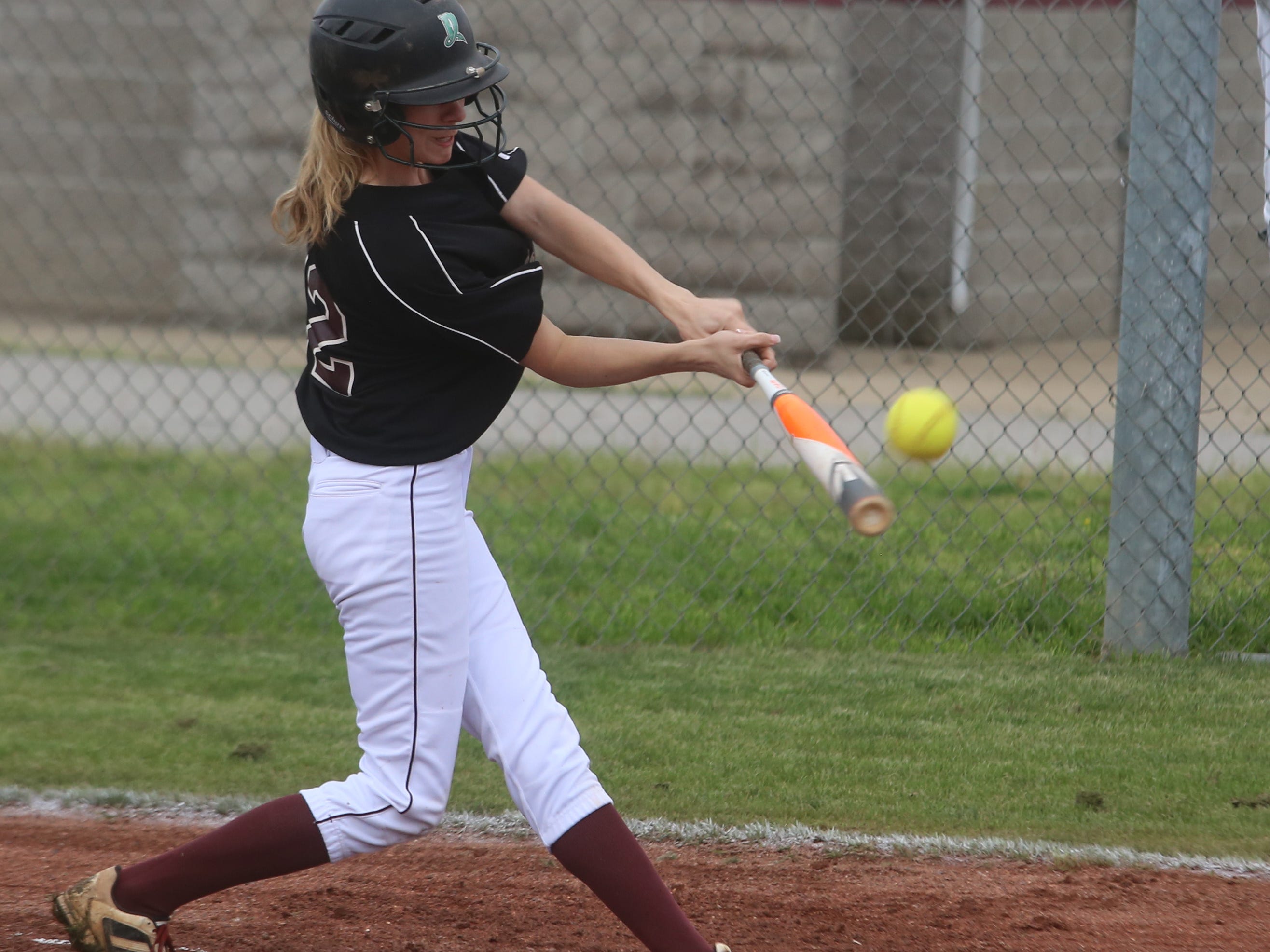 Eagleville leadoff hitter Kelsey Burks makes contact in the first inning of the Lady Eagles' 23-0 win over MTCS on Friday.