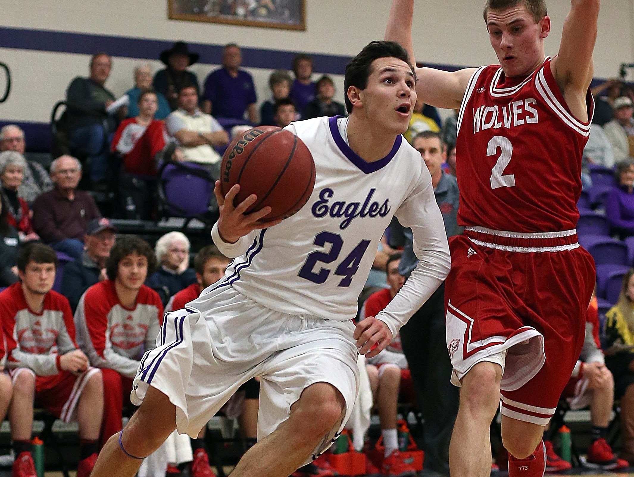 Fair Grove's Kyle Cavanaugh (24) drives to the basket.