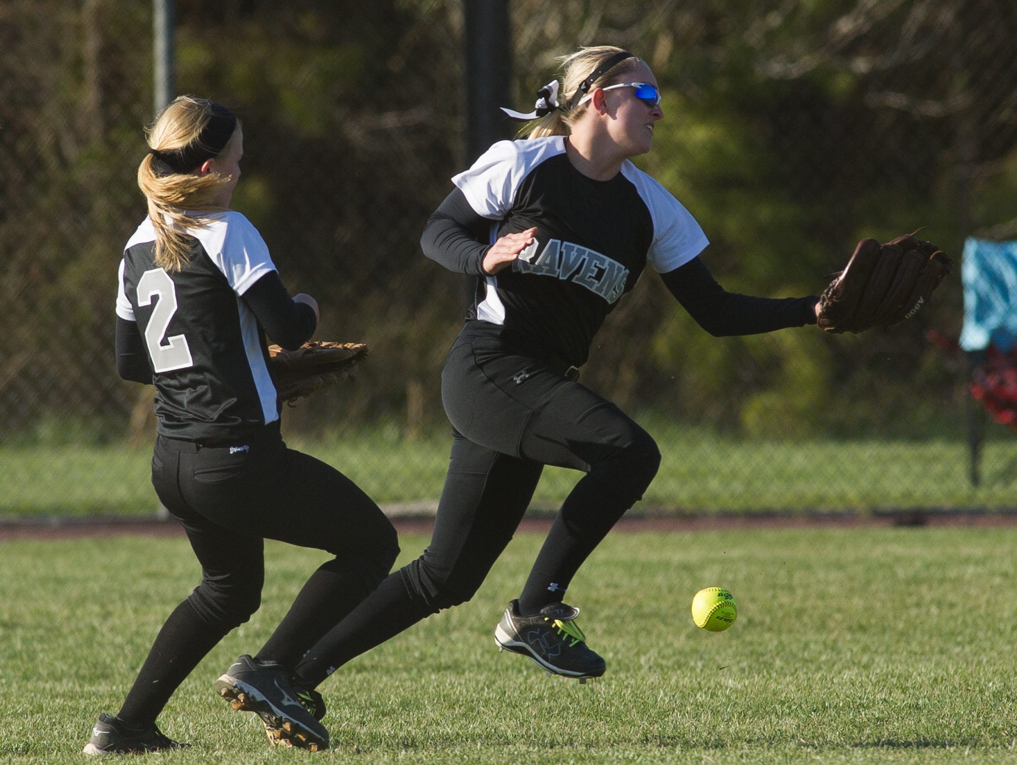 Sussex Tech's Nicole Hovatter (2), left and teammate Brooke Ward (4) miss a fly ball in their out field in their game against Sussex Central.