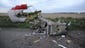 Wreckages from the Malaysian airliner is scattered across a road.