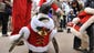 A penguin wearing a Santa Claus costume parades through the Everland amusement park on Dec. 18 in Yongin, South Korea.