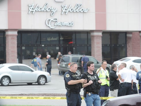 Police and fire crews work the scene of a shooting at a movie theater in Nashville's Antioch neighborhood  Wednesday, Aug. 5, 2015.