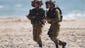 Israeli soldiers patrol along the beach near the Israel-Gaza Border.