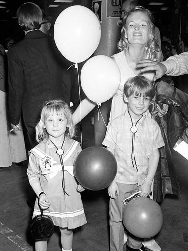 Columbia Records singer Lynn Anderson poses with Karen, 4, and Paul Bishop, 6, of Buffalo, N.Y., while attending the first annual Country Music Fan Fair on April 12, 1972, at the Municipal Auditorium.
