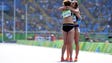 Abbey D'Agostino of the United States, right, hugs