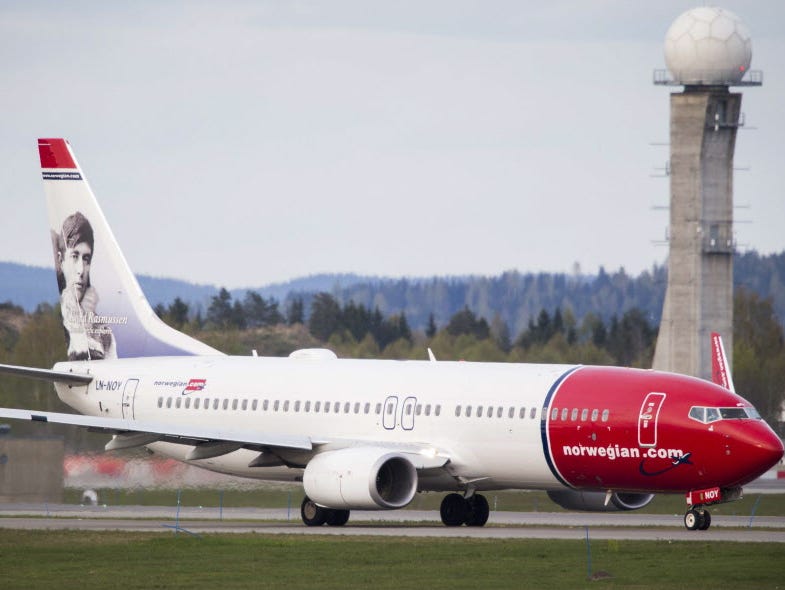 A Boeing 737-33S operated by Norwegian Air Shuttle sits on the tarmac at the Oslo Airport Gardemoen on May 2, 2014. Norwegian announced Thursday flights from Boston, New York and Baltimore-Washington to the Caribbean starting Dec. 3.