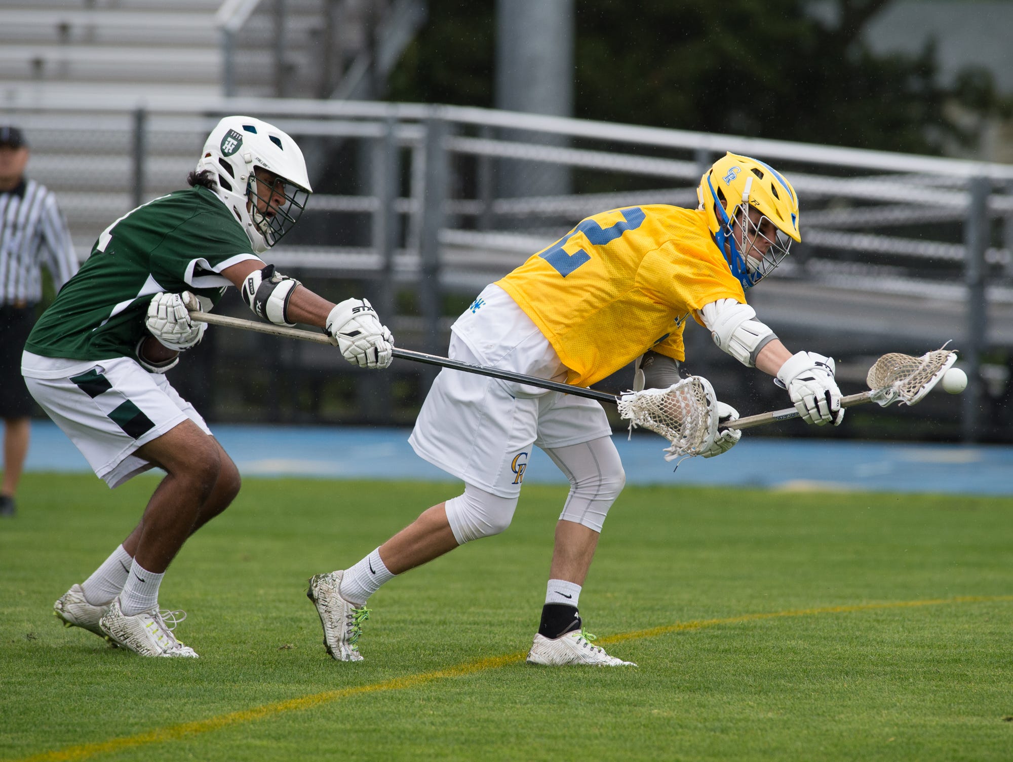 Tower Hill's Tej Vaddi (31), left tries to steal the ball from Caesar Rodney's Jacob Pangle (22).