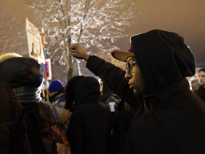 Protesters gather outside the Chicago Police headquarters