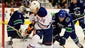 Edmonton Oilers right wing Jordan Eberle has a backhand shot on net against Vancouver Canucks goaltender Roberto Luongo and forward Hunter Shinkaruk.