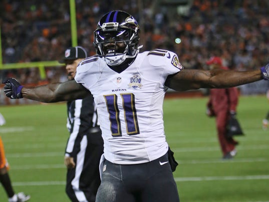 Baltimore Ravens wide receiver Kamar Aiken
celebrates after scoring a Baltimore Ravens wide receiver Kamar Aiken celebrates after
scoring a