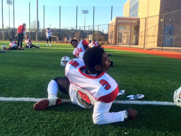 Palmyra senior wide receiver and University of South Carolina recruit Kelvin Harmon leads the Panthers' football team in stretches before their Central Jersey Group 1 final on Dec. 5 at Kean University.