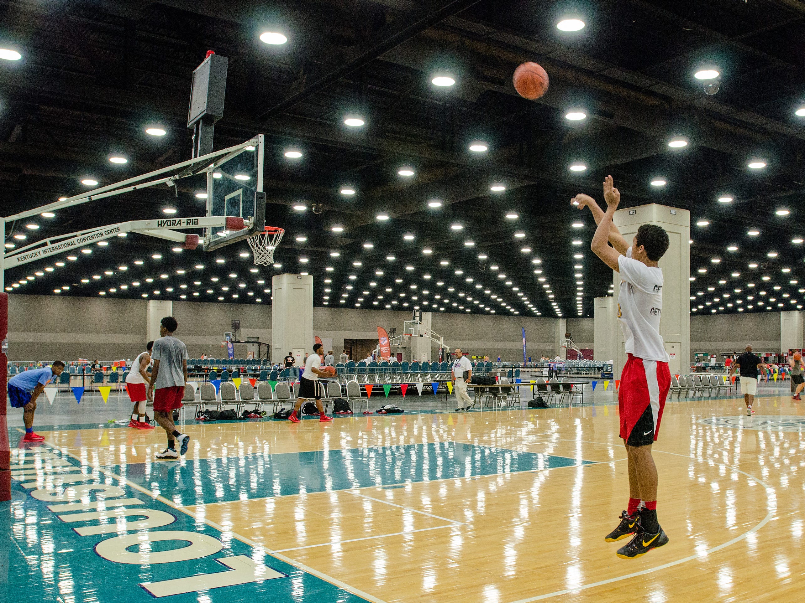 The Arkansas Wings 16-and-under team practices for the Amateur Athletic Union (AAU) Boys Basketball Elite Tournaments in the North Wing of the Kentucky Exposition Center. July 22, 2014