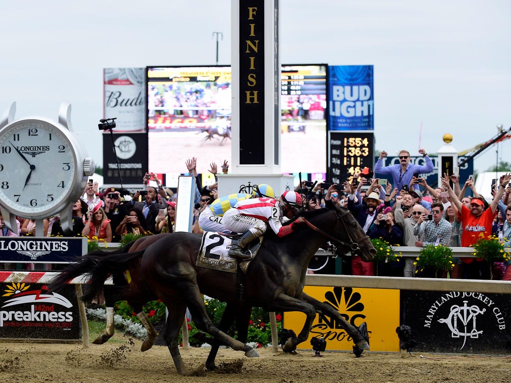 Cloud Computing (2) and Javier Castellano beat Classic Empire and Julien R. Leparoux to the line to win the 142nd Preakness Stakes in Baltimore. Cloud Computing surged to the front down the stretch and edged Classic Empire by a nose.