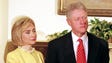 First lady Hillary Clinton stands with President Bill