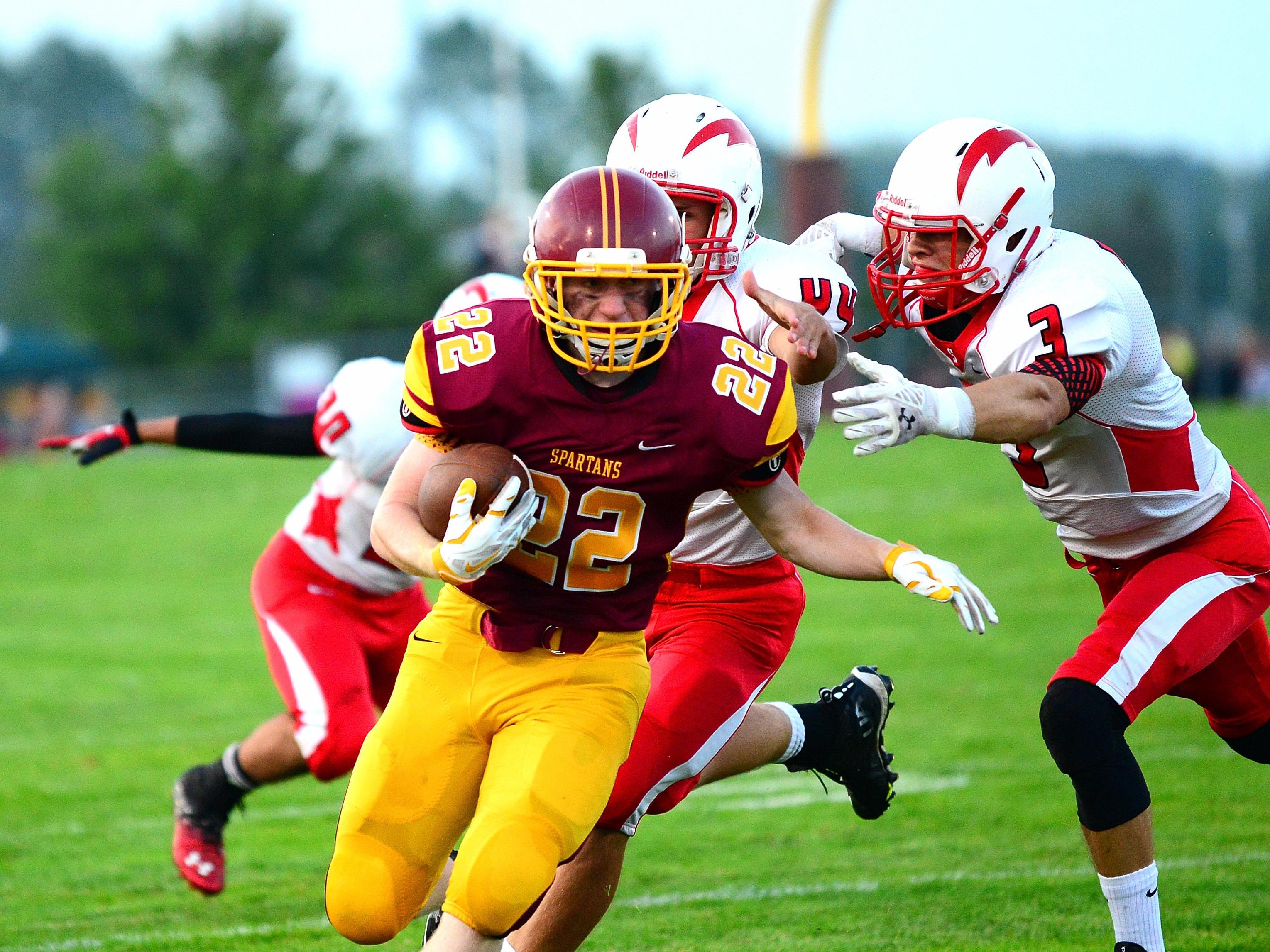 Luxemburg-Casco sophomore Austin Tlachac is run down by Seymour senior Jerad Anderson Friday in a nonconference football game at Luxemburg.