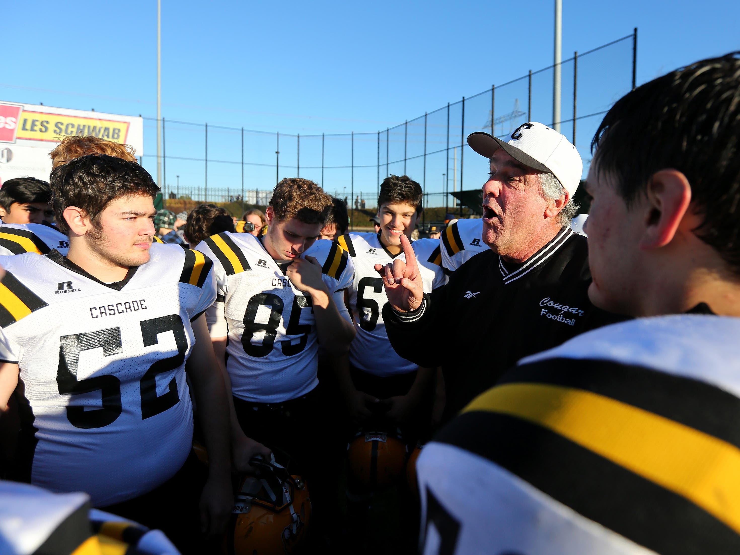 Cascade head coach Steve Turner talks with his team after they won against Scappoose during the OSAA 4A state championship game, Saturday, November 28, 2015, at Hillsboro Stadium in Hillsboro, Ore. Cascade won the game 37-28.