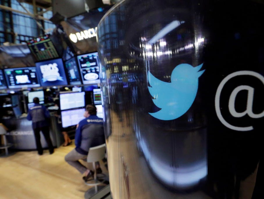 The Twitter logo appears on a phone post on the floor of the New York Stock Exchange, Tuesday, Oct. 13, 2015.