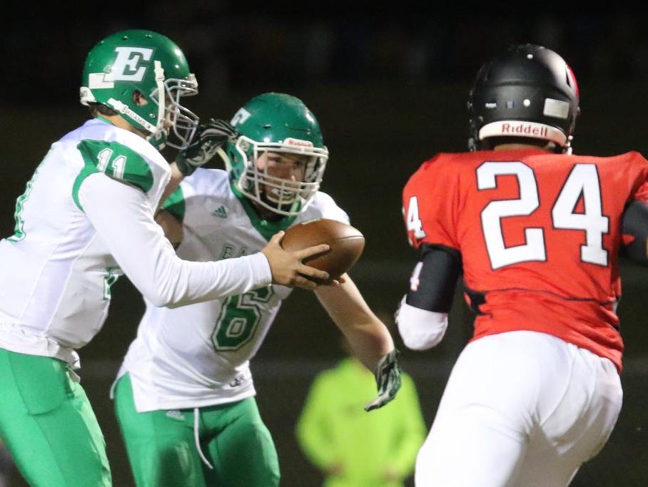 Easley's Dalton Black (11) hands the ball off to Will Drawdy (6) Friday at Hillcrest.