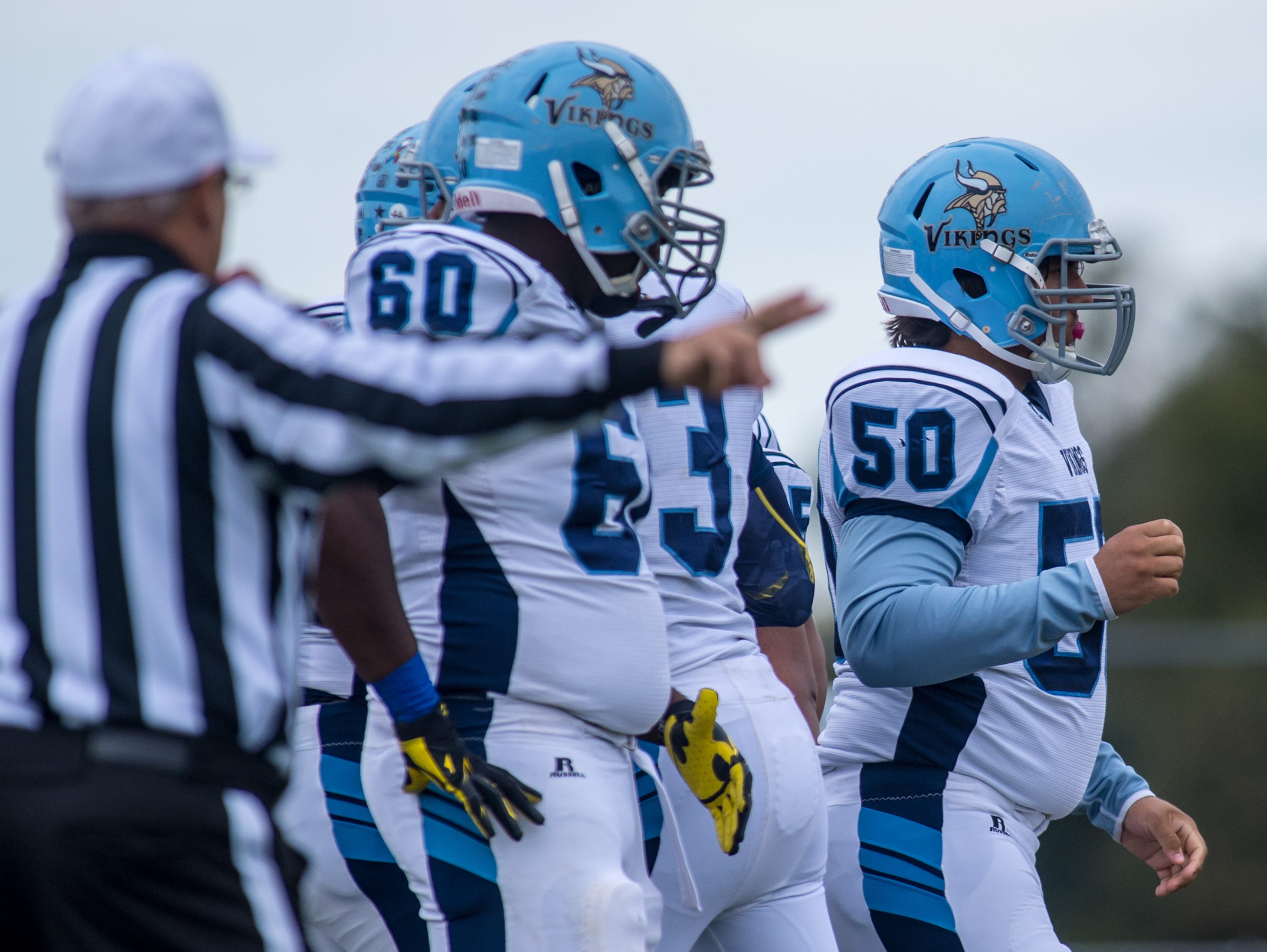 Cape Henlopen center Julian Medina (50) leads out the Viking offense against Sussex Central in Georgetown on Saturday, October 10th.