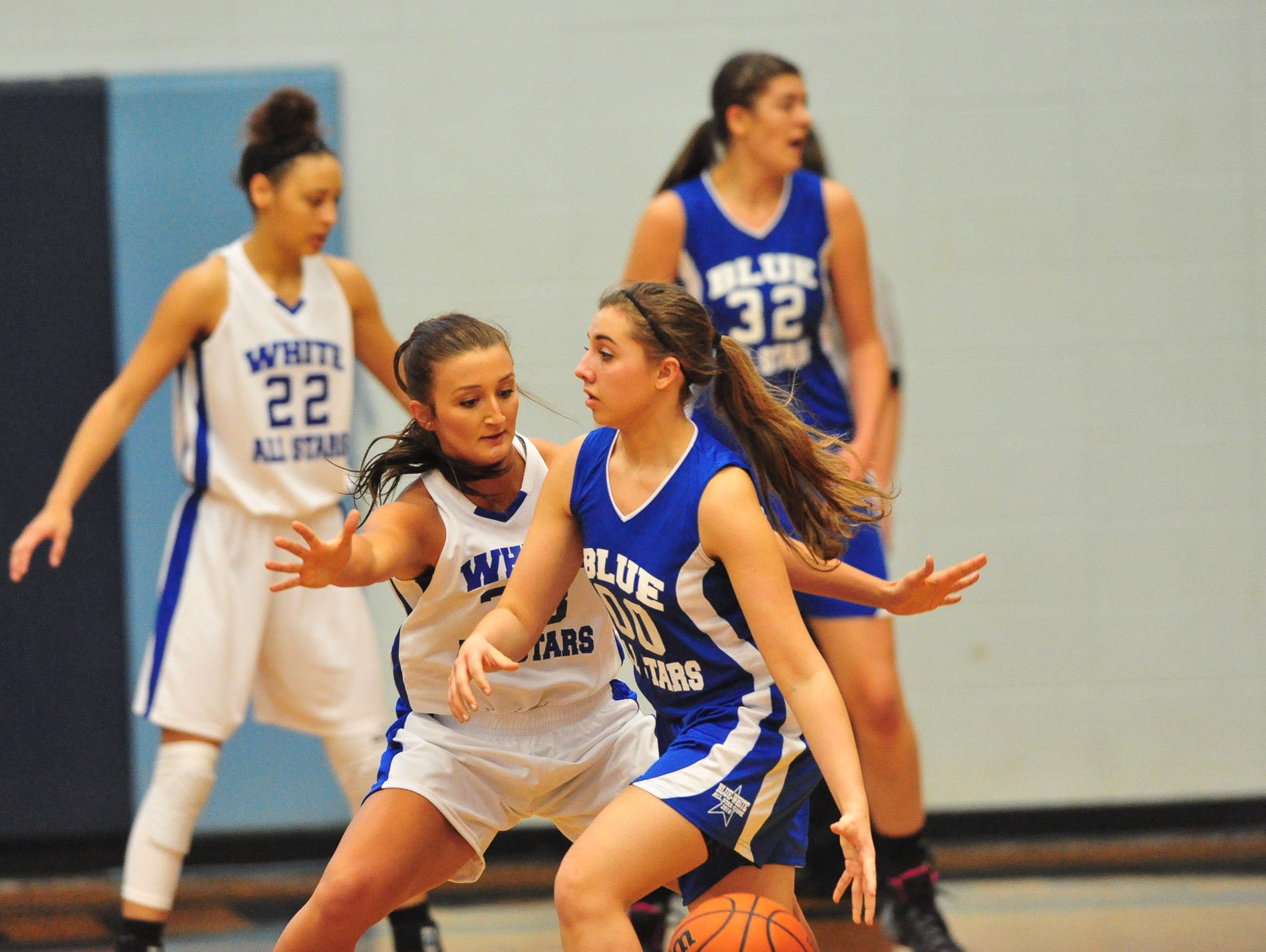 Pisgah's Brooklyn Allen defends Owen's Taylor Lovci during Saturday's Blue-White All-Star girls basketball game at Enka.