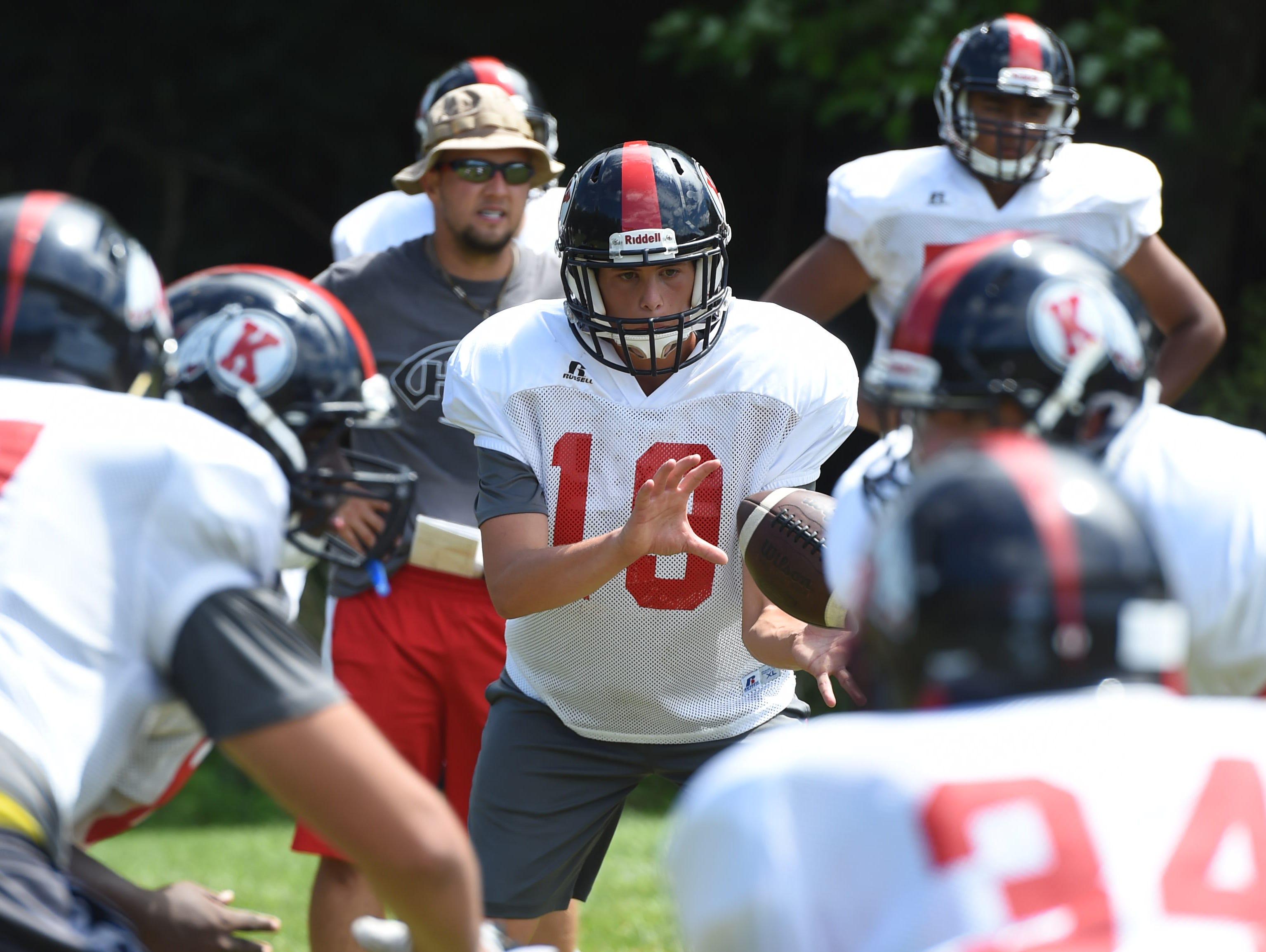 Roy C. Ketcham's Sam Vivace receives the ball during preseason practice on Wednesday. Vivace, a senior, was practicing offensive drills. Ketcham coach Bryan Hogan has not yet decided on his quarterback.