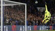 Chelsea goalkeeper Thibaut Courtois jumps but fails